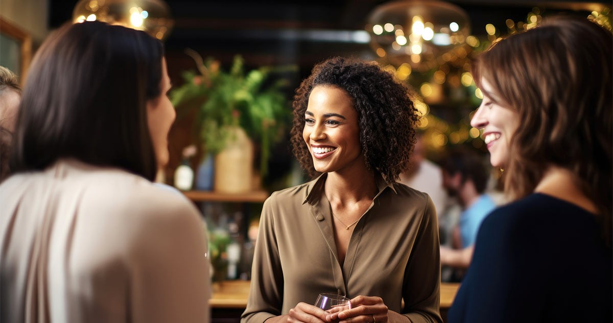 Woman entrepreneur on a networking event talking to other women